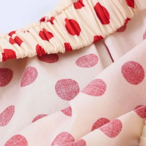 Detail view of elastic waist on retro red polka dot print summer cotton blend top