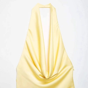 Pale yellow backless satin halter dress with a deep V cowl neck for women