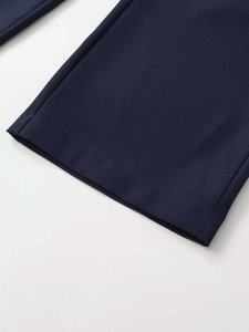 Close-up of navy blue straight pants showing detailed twill texture and neat stitching