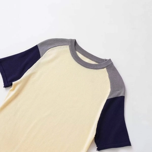 Three-tone color block short sleeve knit top with raglan sleeves and crew neck design