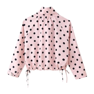 Detailed back view of pink polka dot jacket with stand collar and drawstring hem