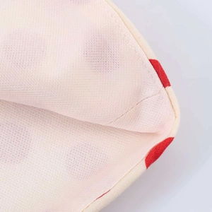 Retro cream strapless top with vibrant red polka dots and fine stitching details
