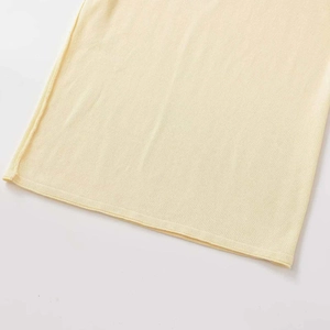 Women's two-tone raglan sleeve knit top in light cream yellow with fine knit texture