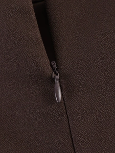 Macro detail of high-quality invisible zipper on dark brown matte textured fabric