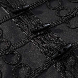 Detail of military-style jacket showing black frogging braids and toggle closures