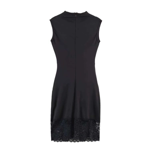 Detail of the black sleeveless dress with back zipper and floral lace hem on white background