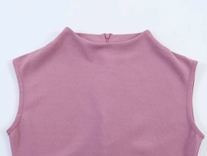 Close-up of dusty pink sleeveless top with back invisible zipper and textured fabric
