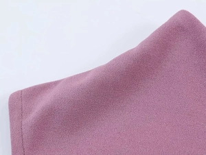 Close-up of purple lace splicing dress showing detailed crinkle fabric texture and stitching