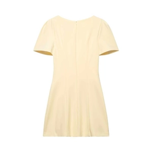 Detailed view of pale yellow mini dress with a-line silhouette and hidden back zipper