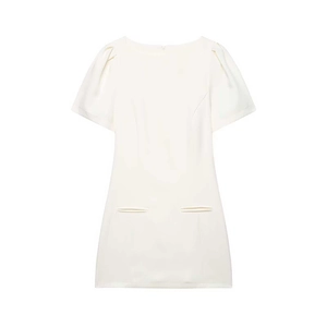Detail of white puff sleeve mini dress with pleated pockets and elegant neckline