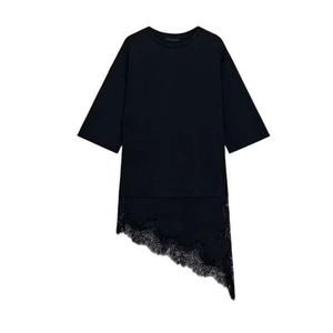 Minimalist black short sleeve T-shirt with asymmetric lace hem detail on white background