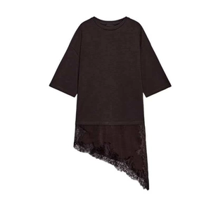 Detail of delicate black lace hem on asymmetrical minimalist women's cotton t-shirt