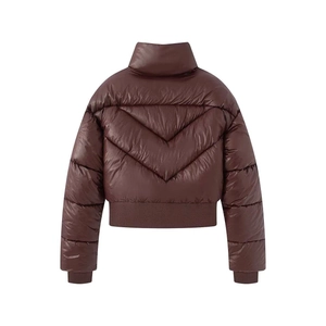 Detail of V-shape quilted pattern on dark brown winter jacket with ribbed cuffs