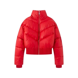 Detailed macro view of the bright red quilted puffer jacket with silver metallic F-zipper