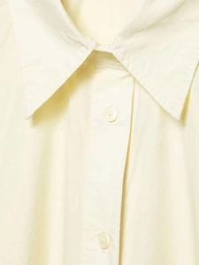 Detail view of cotton poplin shirt featuring pointed collar and matching round buttons