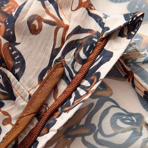Macro shot of retro floral fabric with drawstrings and precise stitching on the jacket