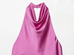Macro detail of rose pink satin cowl neck top with shimmering silk-like fabric texture