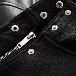 Black faux leather bomber jacket with stand collar, silver zippers and snap button details