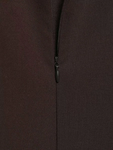 Detail of high-quality invisible zipper on dark brown pleated dress fabric