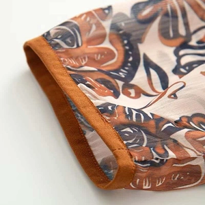 Macro detail of vintage floral pattern and neat stitching on sun protection jacket hem