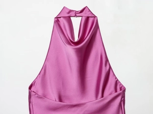 Detail of fuchsia satin halter top showing elegant cowl neckline and silky texture