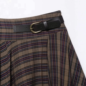 Vintage brown plaid midi skirt with a black leather belt and bronze metal buckle