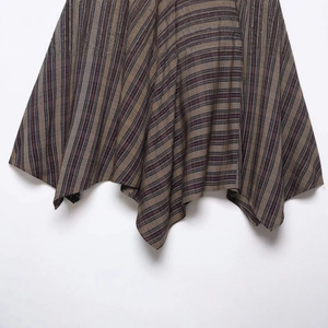 Retro multicolored striped skirt with an asymmetrical handkerchief hem and woven texture