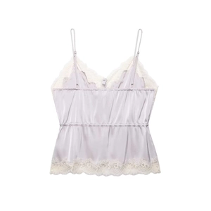 Detail view of light purple satin camisole with delicate white lace trim and V-neckline