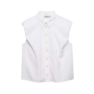 Detail view of the white sleeveless shirt collar with buttons and textured seersucker fabric