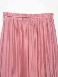 Detail of light pink pleated skirt showing elastic waist and vertical micro-ribbed texture