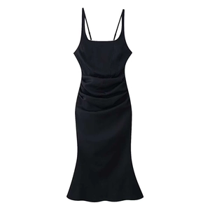 Detail of black satin camisole dress with pleated waist and elegant flared hemline