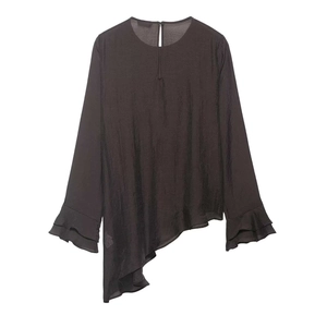 Detail of elegant ruffled cuffs and asymmetrical hem on this charcoal chiffon blouse