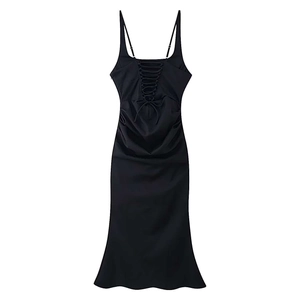 Detail of black camisole dress featuring back lace-up design and elegant waist ruching