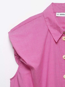 Detailed shot of pink and white gingham shirt featuring classic collar and white buttons