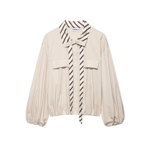 Beige button-up blouse featuring striped tie detail, lantern sleeves, and cargo pockets