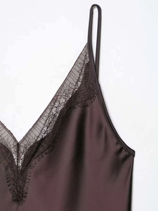 Detail of V-neck lace trim and thin straps on dark brown satin camisole dress