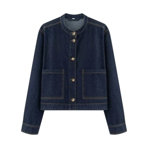 Detail of dark blue denim jacket with round neck and large square pockets