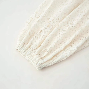 Women's summer white lace wide-leg pants featuring delicate floral hollow-out embroidery