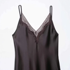 Elegant black satin slip top with V-neck lace trim and delicate spaghetti straps