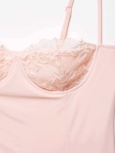 Close-up of pink satin camisole with delicate lace cups and adjustable straps