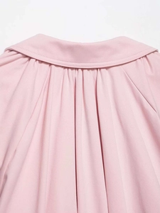 Detail view of pink bomber jacket collar with elegant gathered texture on back