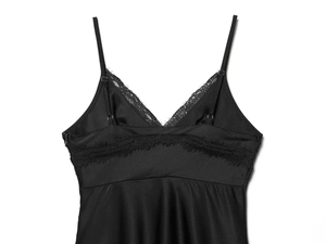Detailed close-up of silk satin V-neck nightgown featuring intricate black lace trim edges