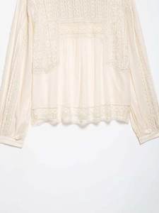 Detailed view of apricot lace patchwork and hollow out design on chiffon long sleeve blouse