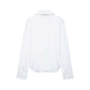 Minimalist loose white long-sleeve shirt with lapel collar and curved hem for women