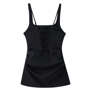 Detail view of the lace-up back design and ruched fabric on this black slim dress