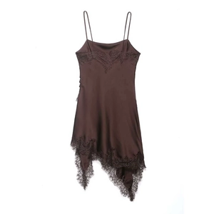 Detail of dark brown satin dress with delicate eyelash lace trim and asymmetric hemline