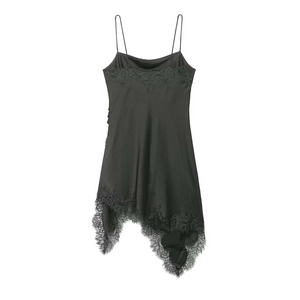 Close-up of black satin dress featuring intricate lace trim and a delicate strap design