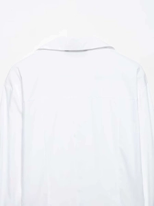 Close-up of white cotton shirt collar and back yoke with high-quality minimalist tailoring