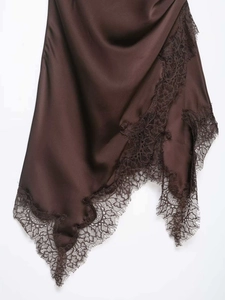 Detail of coffee satin dress featuring delicate eyelash lace trim on the hemline