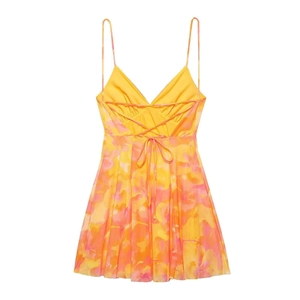 Detail of floral chiffon mini dress showing back cross-tie straps and colorful print